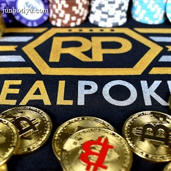 Stacks of poker chips in various colors are arranged in the background, while in the foreground, there are numerous golden coins featuring the Bitcoin symbol. The text 'REALPOKER' is prominently displayed in gold and silver lettering on a dark background.
